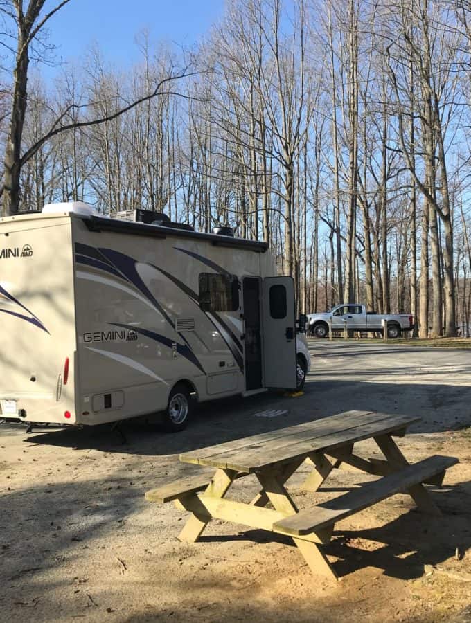 motor home in trees at pond setting