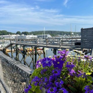 Footbridge and flowers in Boothbay, ME