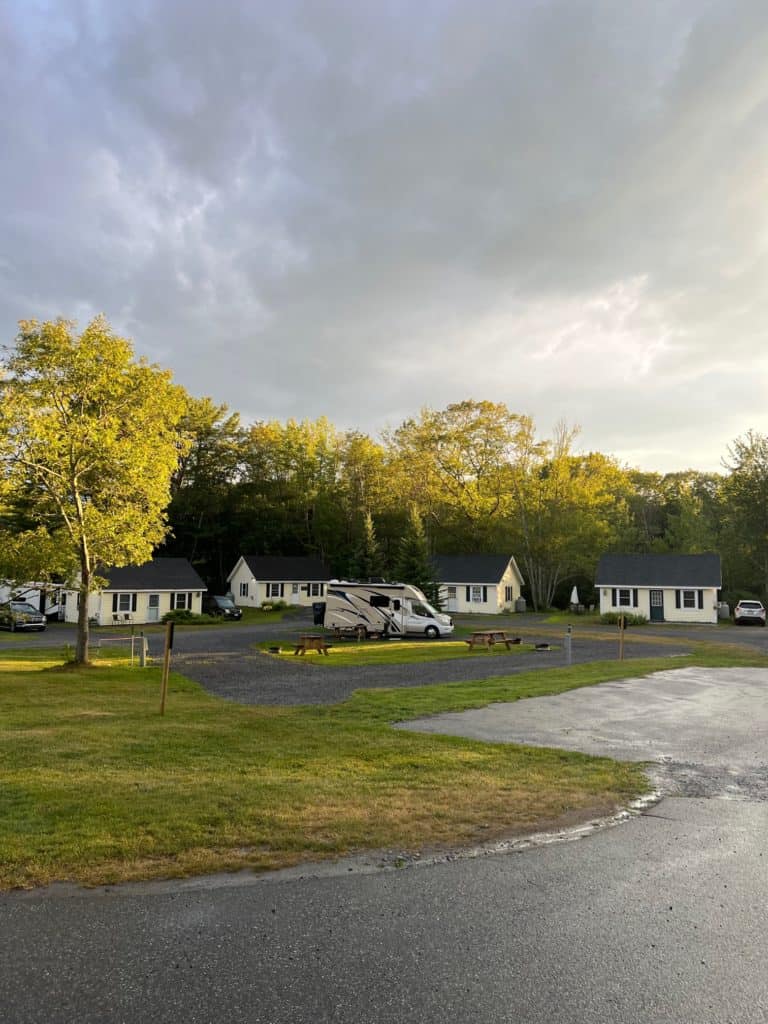 Picture of Boothbay Brewery and RV Park in the evening eith cabins and RVs in view