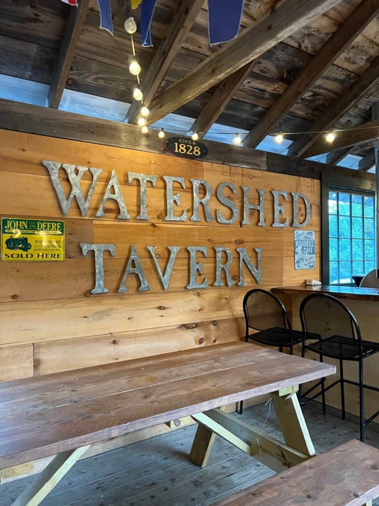 View of the the covered outdoor dining space at Boothbay Craft Brewery