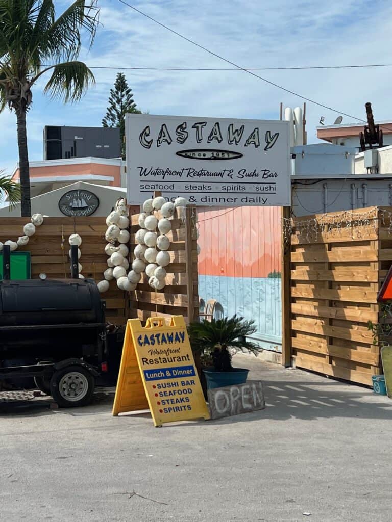 Image of the signs at the entrance to Castaway restaurant in Marathon, Florida.