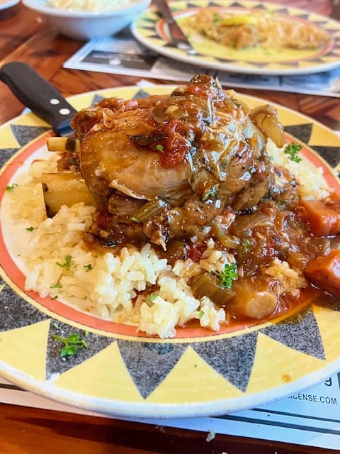 colorful plate of food with veal Osso Bucco over risotto