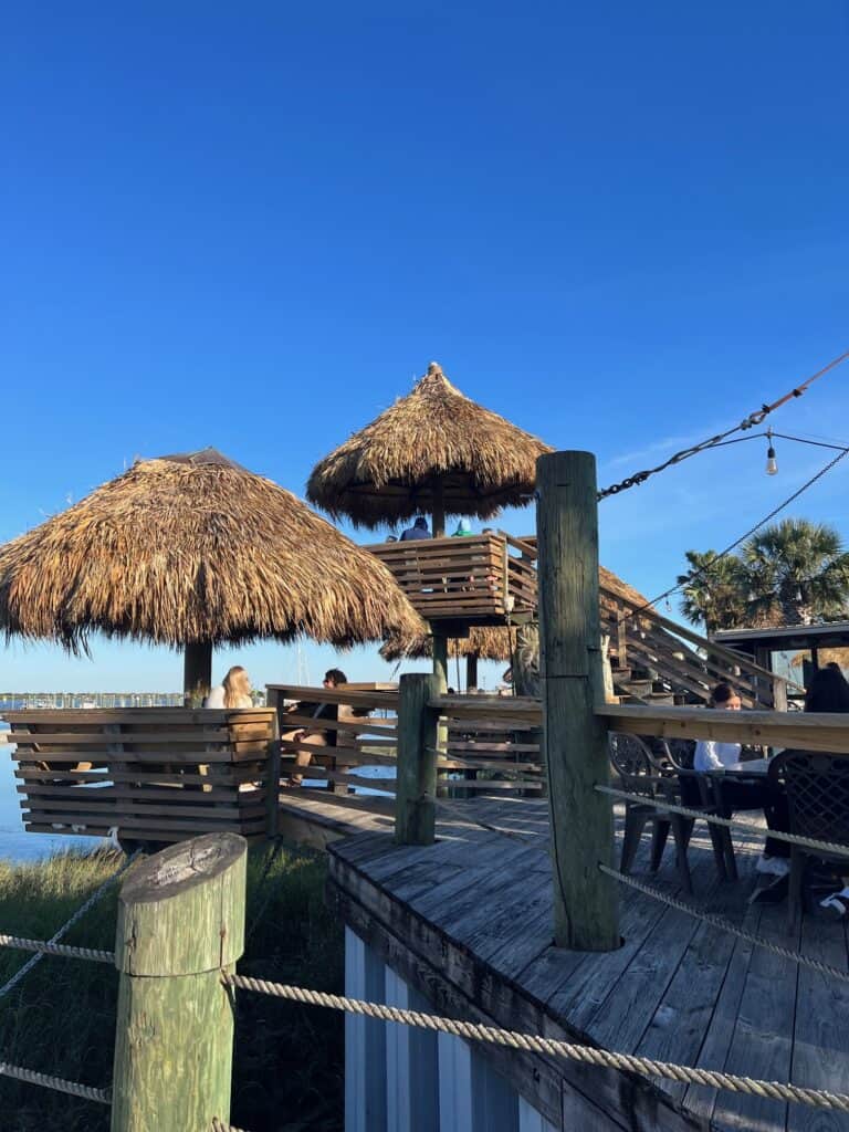 Tiki style individual huts for outdoor dining in St. Augustine at the Conch House