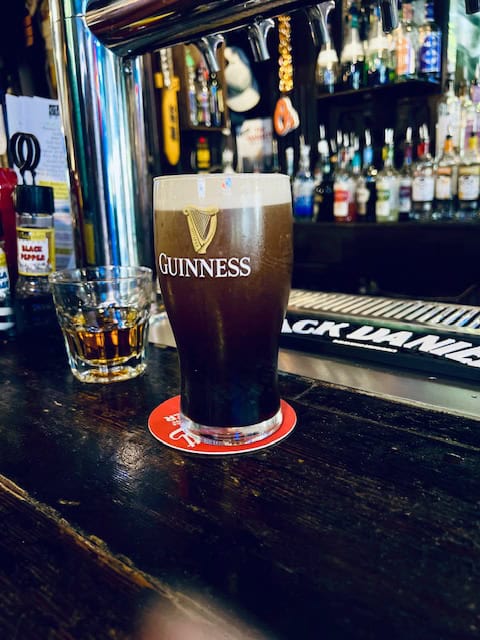 A well poured Guinness in a glass from Stan and Joe's on West Street in Annapolis