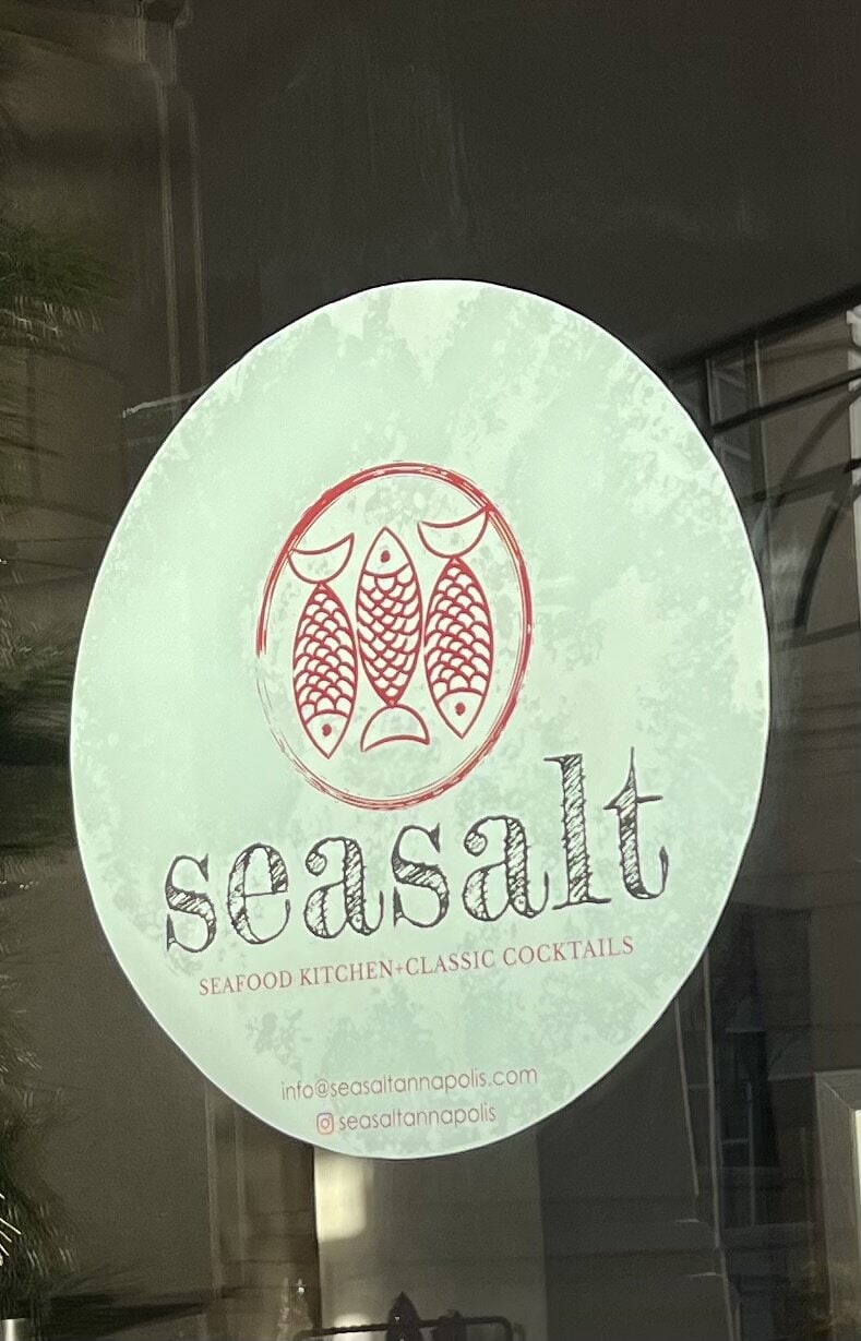 Sign on the door at Seasalt an oyster bar and seafood restaurant in Annapolis