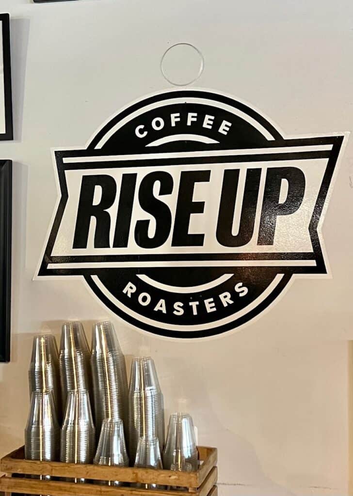 Logo for Rise Up inside their Market House location in Annapolis.