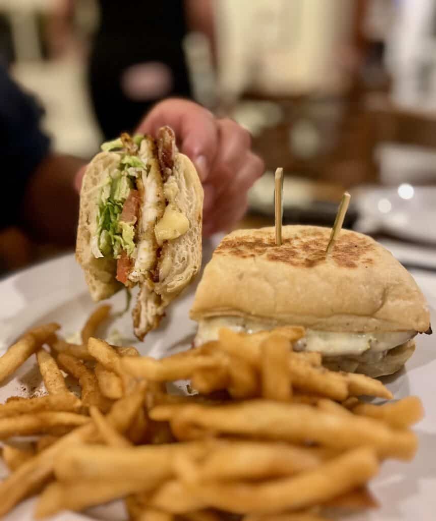 Fish sandwich with fries on a plate
