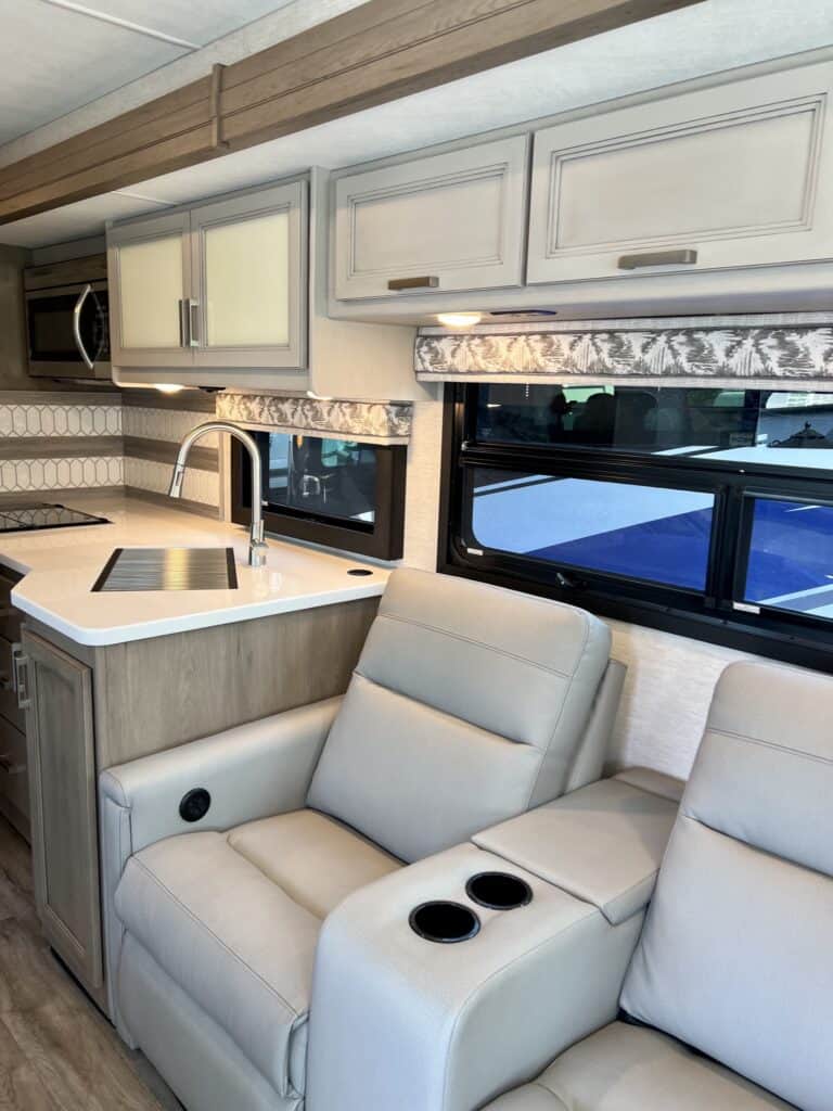 View of a white and neutral RV kitchen interior